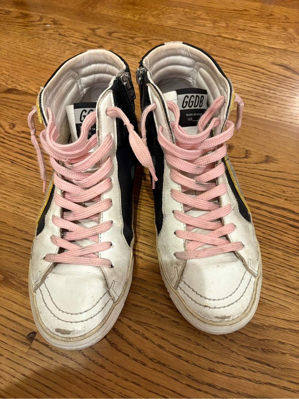 Golden Goose White and Black High-Top Sneakers with Pink Laces and Yellow Accent